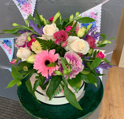 Colour Pop Hat Box - A colourful hat box arrangement bursting with pink, cream and purple tones, perfect for birthdays, congratulations or thank yous, handcrafted by Pursehouse Florist in Cannock.