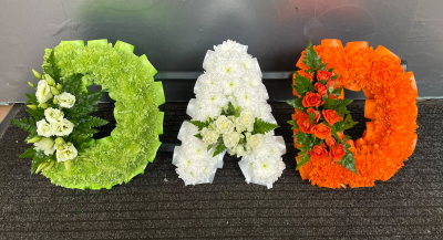 Irish Flag Letter Tribute - Personalised letter funeral tributes in the green, white and orange of the Irish flag, handcrafted with care by Pursehouse Florist in Cannock.